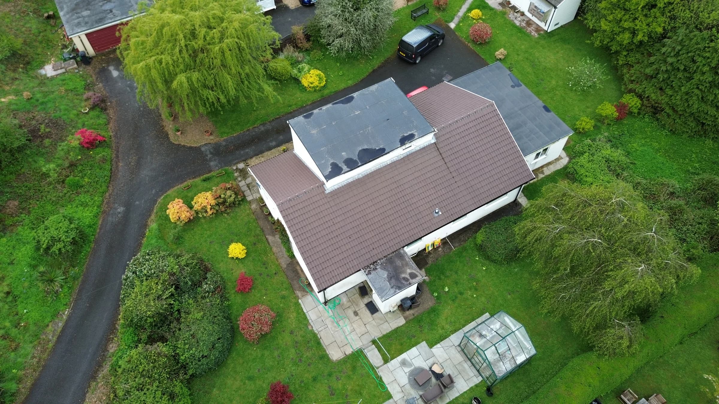 House with a flat roof section before conversion works, aerial view, Neath