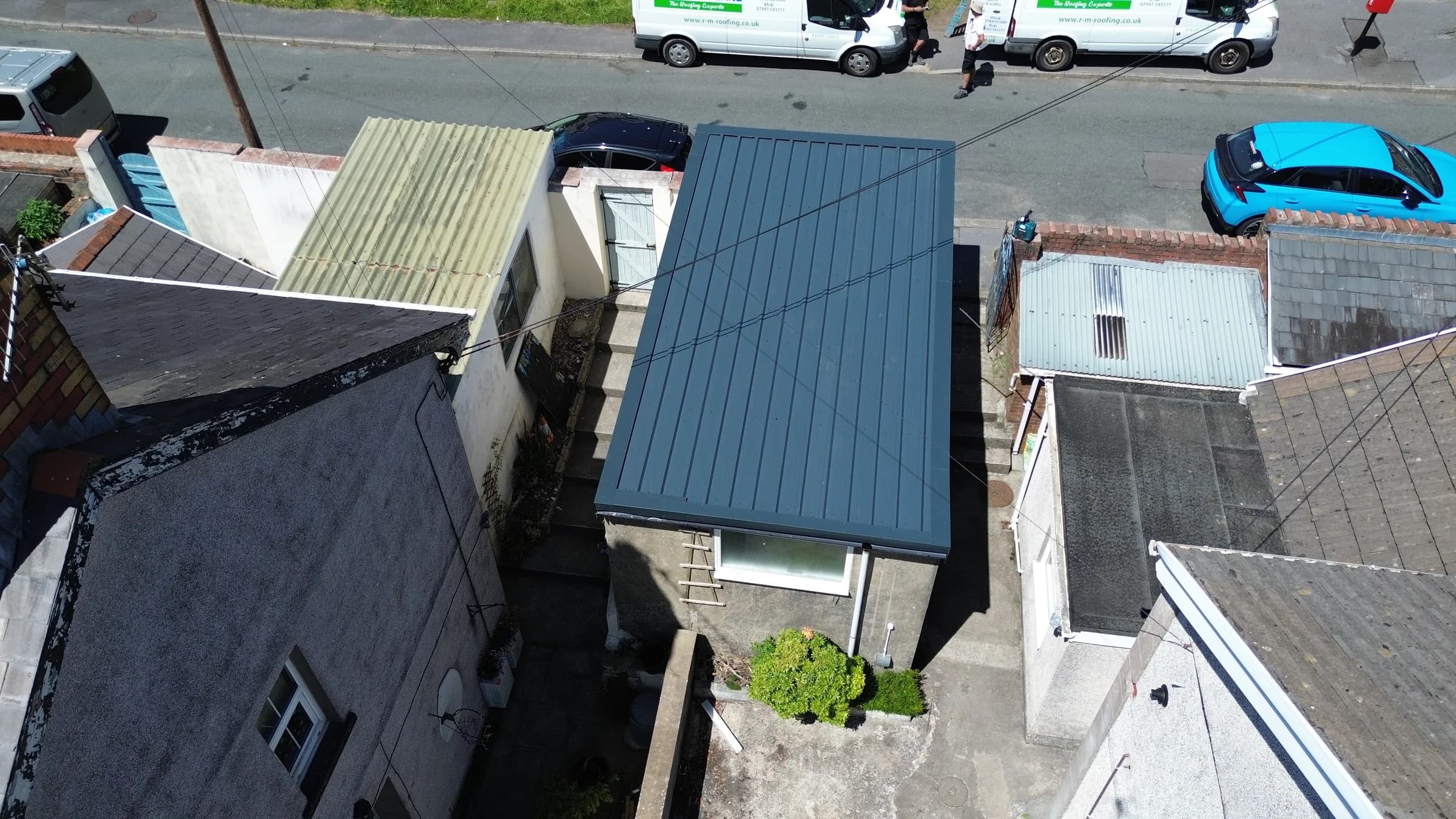 Standing seam metal roof on an industrial unit, aerial view, Neath