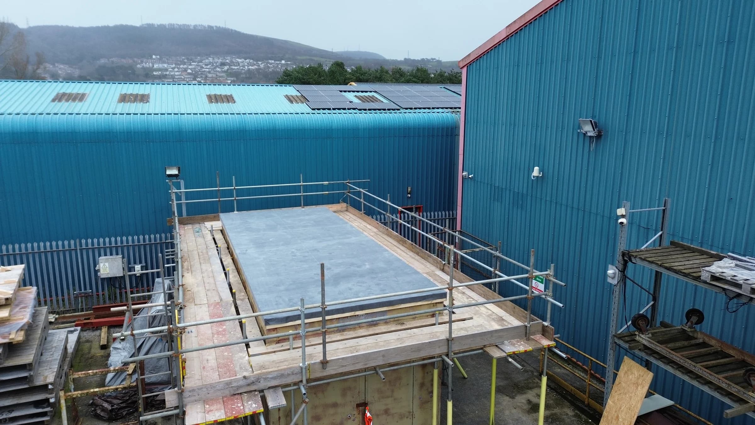 Commercial flat roof installation on an industrial unit in Neath